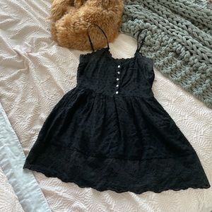 Black swiss dot and lace mini dress with side zip